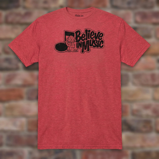 Heather Red Believe in Music T-shirt flat-lay on weathered brick
