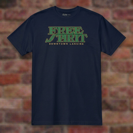 Free Spirit Downtown Lansing Navy T-shirt flat lay on brick background