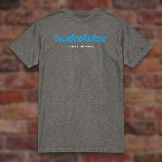 Hydrotube Graphite Heather T-shirt flat lay on brick background