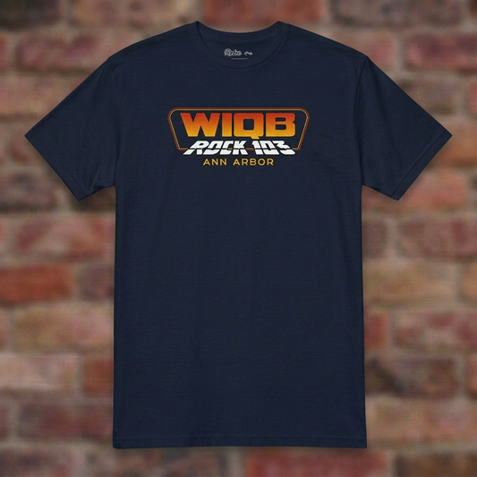 WIQB Rock 103 Navy T-shirt flat lay on brick background