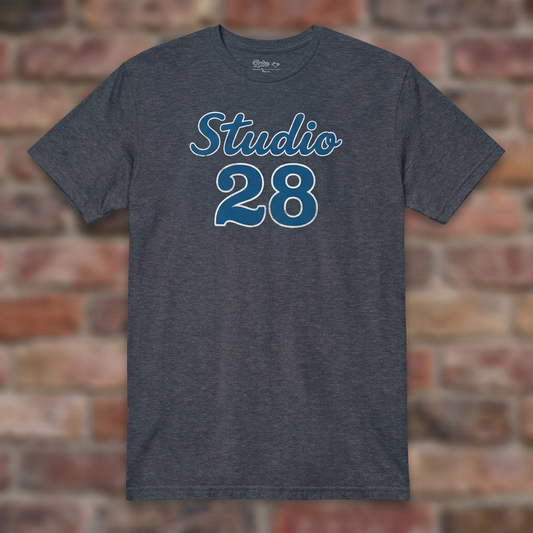 Studio 28 Heather Navy T-shirt flat lay on brick background