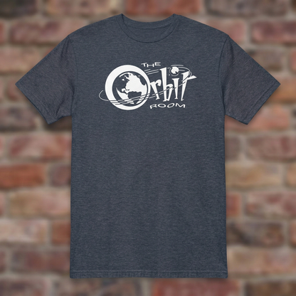 The Orbit Room Heather Navy T-shirt flat lay on weathered brick background