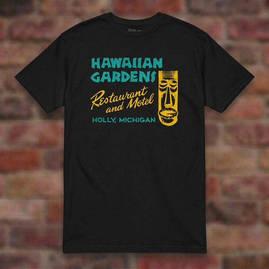 Hawaiian Gardens Black T-shirt flat lay on brick background