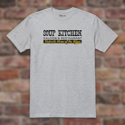 Soup Kitchen Saloon Sport Grey T-shirt flat lay on brick background