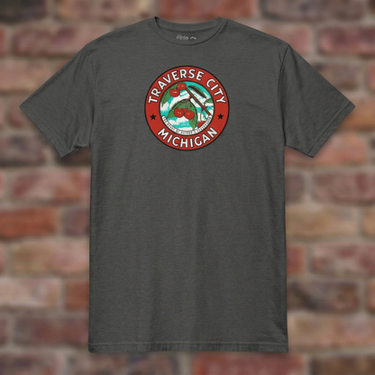 Traverse City Michigan Dark Heather Grey T-shirt flat lay on brick background