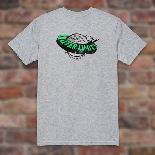 Outer Limits Sport Grey T-shirt flat lay on brick background