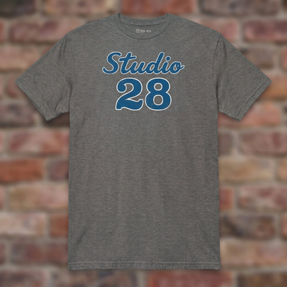 Studio 28 Graphite Heather T-shirt flat lay on brick background