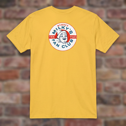 Milky the Clown Fan Club T-shirt in Daisy, flat lay on warm brick background