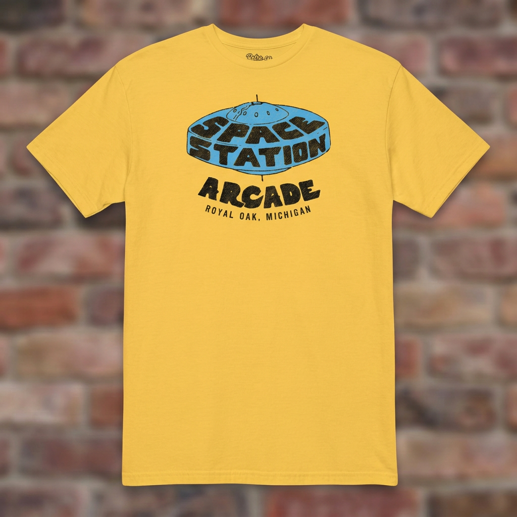 Space Station Arcade Daisy T-shirt flat lay on brick background