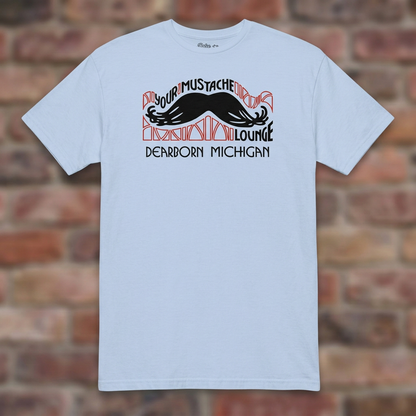 Your Mustache Lounge Dearborn Light Blue T-shirt flat lay on brick background