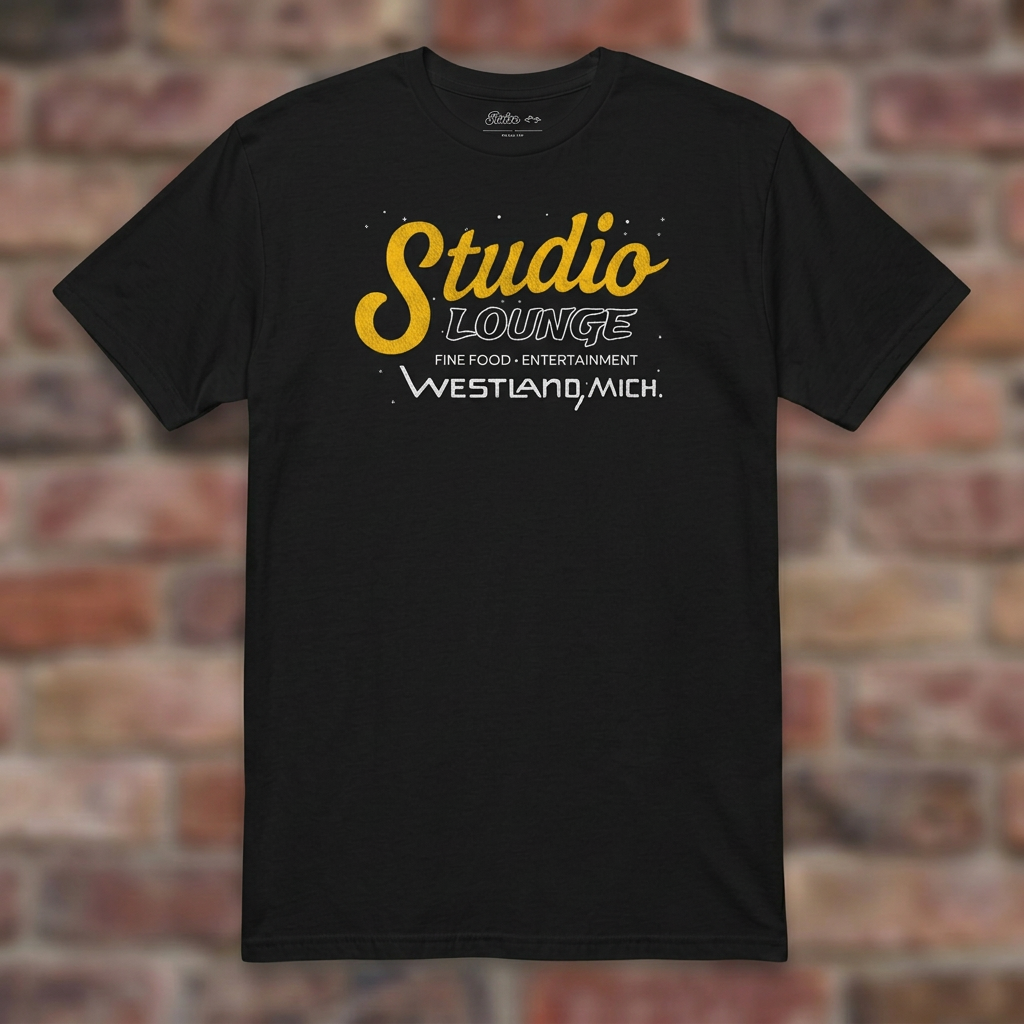 Studio Lounge Black T-shirt flat lay on brick background