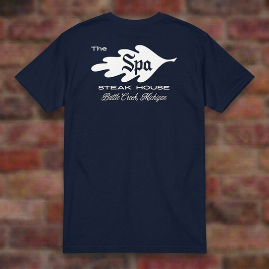 The Spa Steak House Navy T-shirt flat lay on brick background