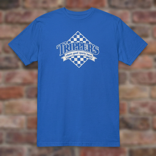 Trippers Lansing Royal T-shirt flat lay on brick background