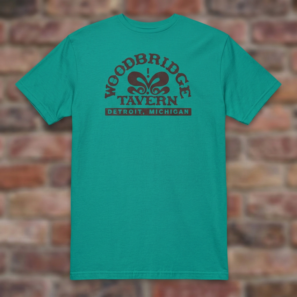 Woodbridge Tavern Jade Dome T-shirt flat lay on brick background