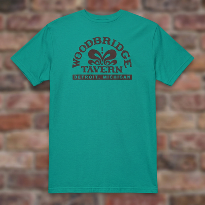 Woodbridge Tavern Jade Dome T-shirt flat lay on brick background