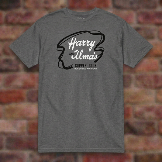 Harry and Alma's Graphite Heather T-shirt flat lay on brick background