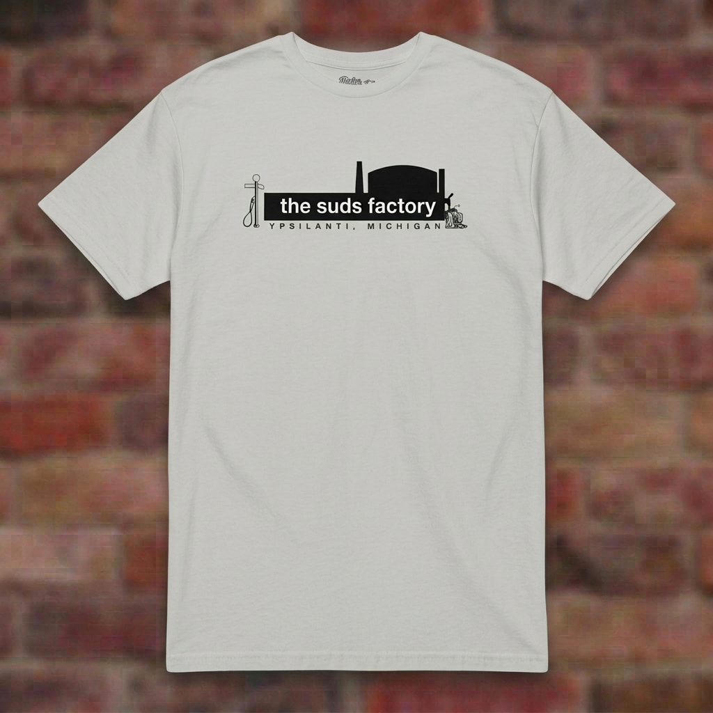 The Suds Factory Ice Grey T-shirt flat lay on brick background