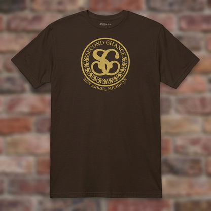 Second Chance Dark Chocolate T-shirt flat lay on brick background