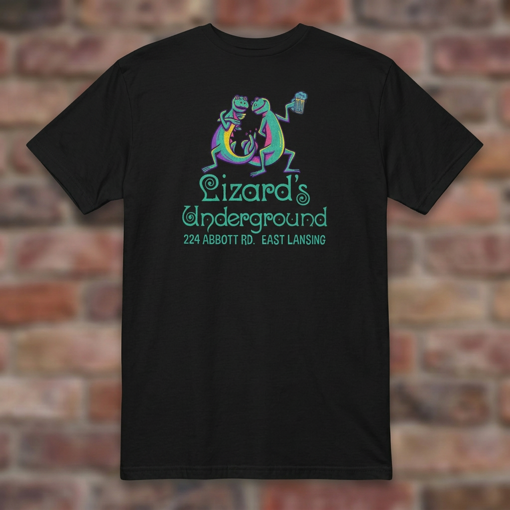 Lizard's Underground East Lansing Black T-shirt flat lay on brick background