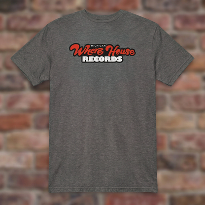 Wherehouse Records Michigan Graphite Heather T-shirt flat lay on brick background