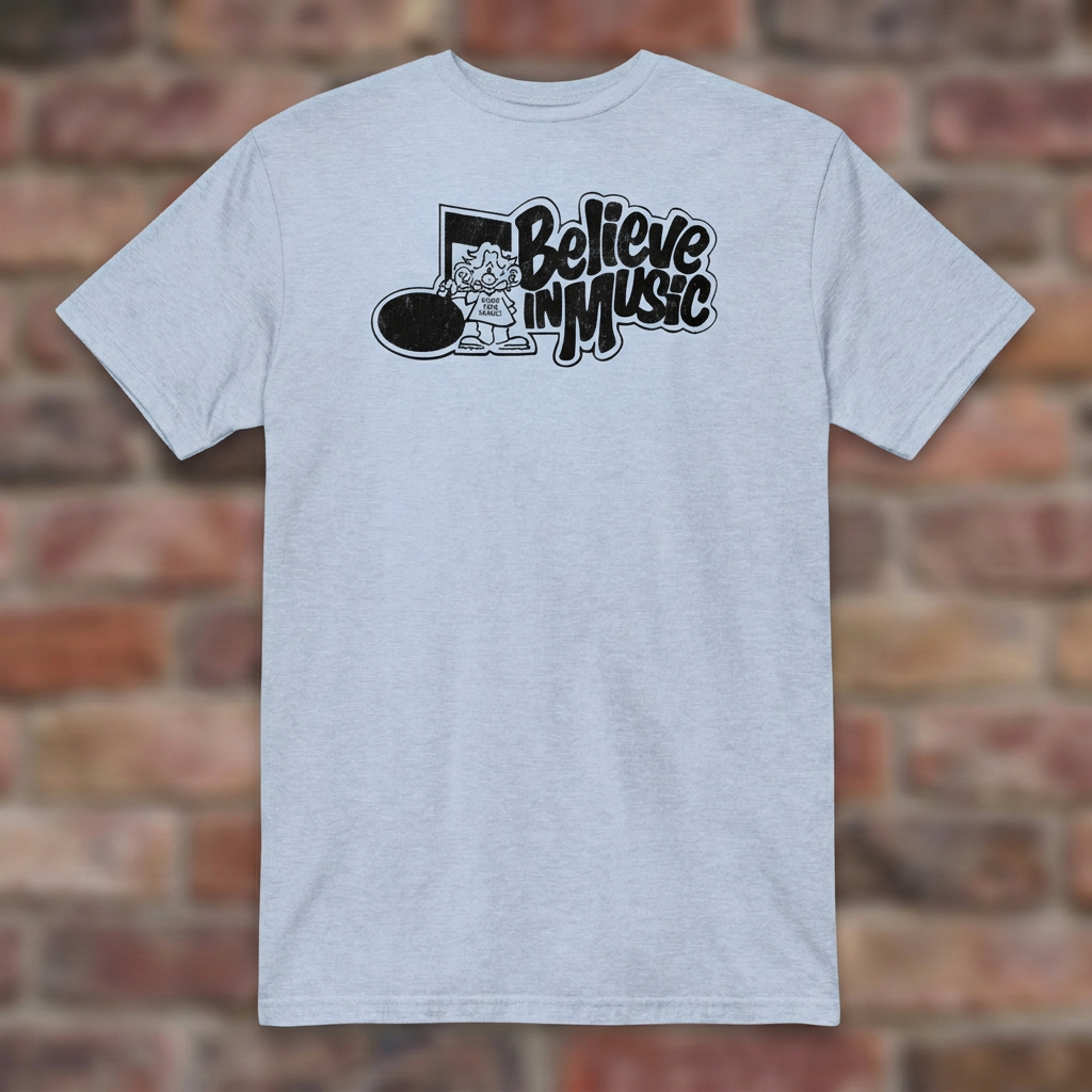 Light Blue Believe in Music T-shirt flat-lay on weathered brick