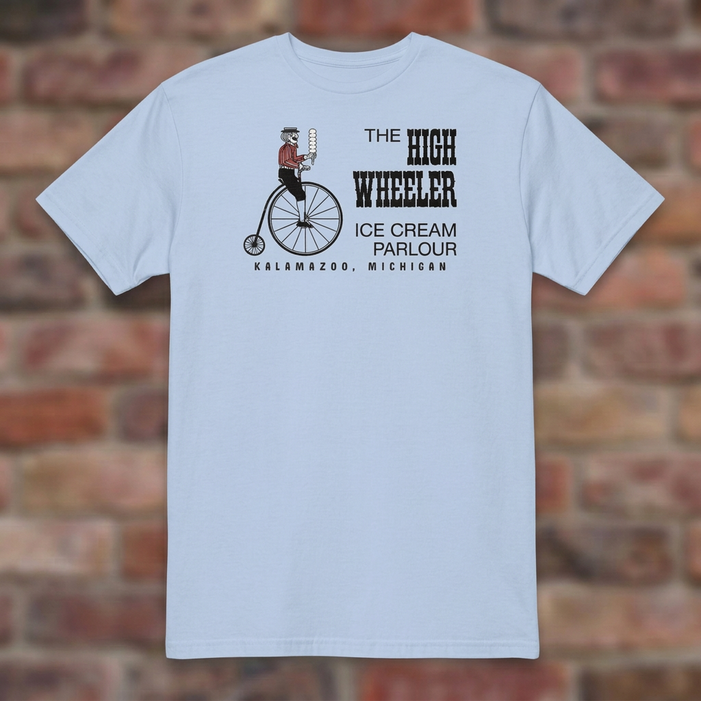 High Wheeler Light Blue T-shirt flat lay on brick background