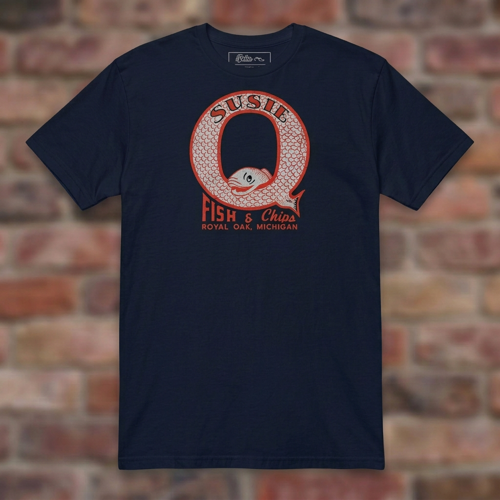 Susie Q Fish-n-Chips Navy T-shirt flat lay on brick background