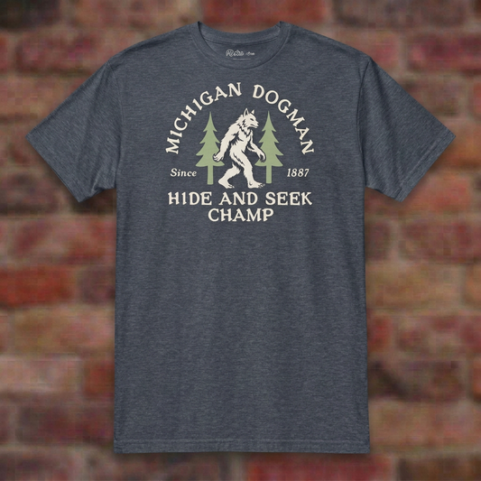 Michigan Dogman Heather Navy T-shirt flat lay on brick background