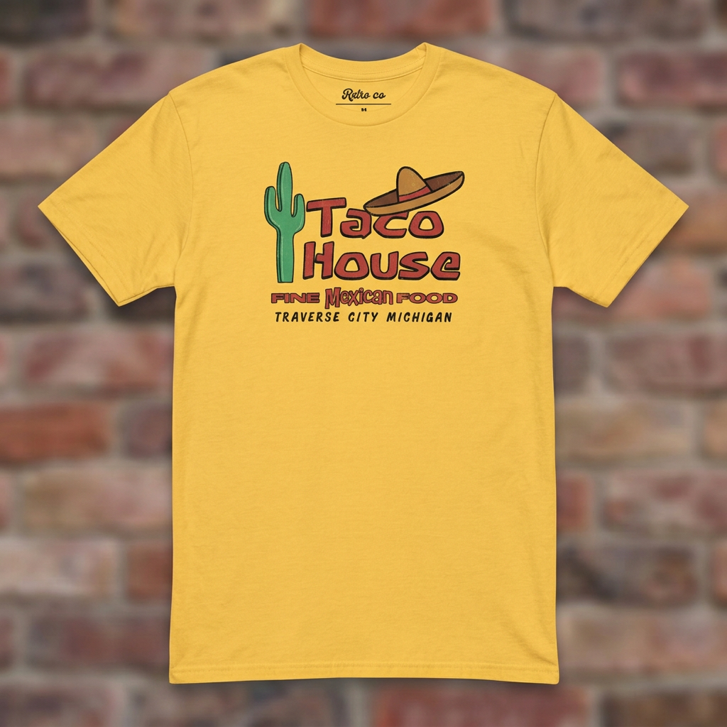 Taco House Traverse City Daisy T-shirt flat lay on brick background