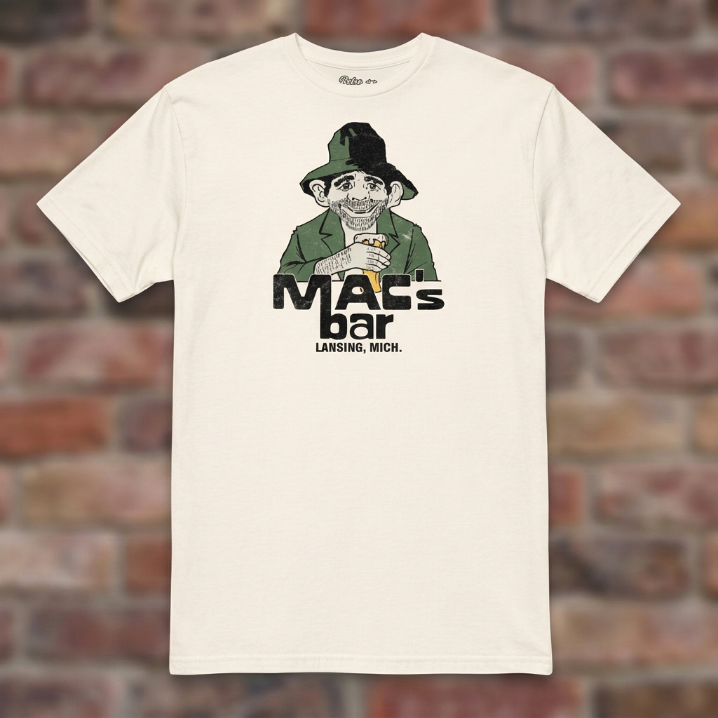 Natural Mac's Bar Lansing T-shirt flat-lay against weathered brick