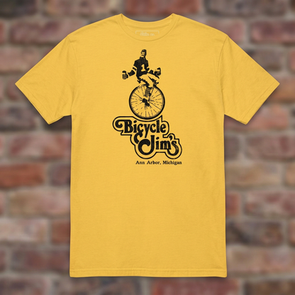 Bicycle Jim's Daisy T-shirt flat lay on brick background