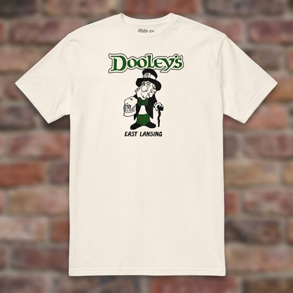 Natural Dooley's East Lansing T-shirt flat-lay against weathered brick