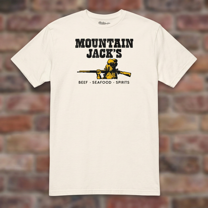 Mountain Jack's Natural T-shirt flat lay on brick background