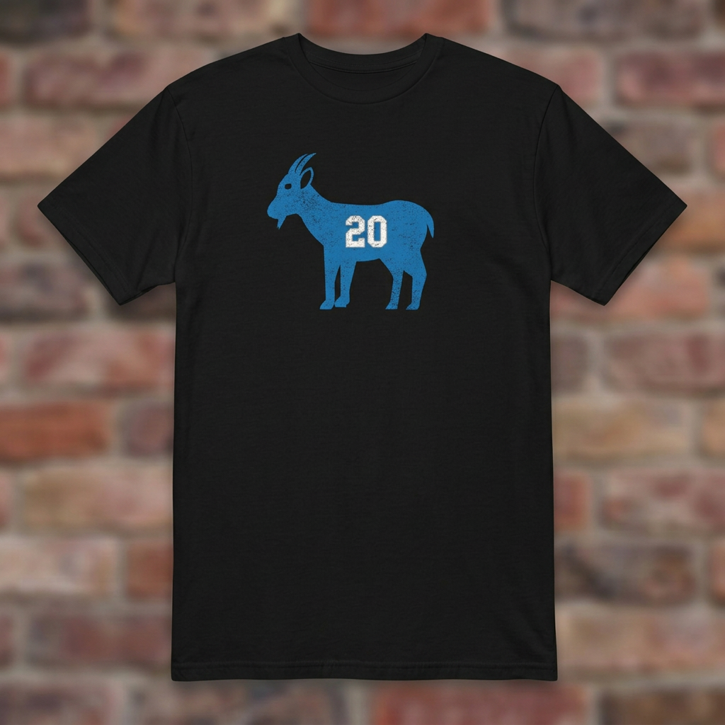 GOAT Barry Black T-shirt flat lay on brick background