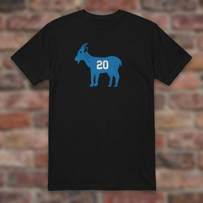 GOAT Barry Black T-shirt flat lay on brick background