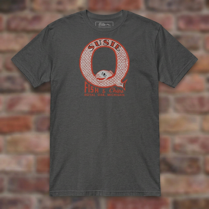 Susie Q Fish-n-Chips Dark Heather Grey T-shirt flat lay on brick background