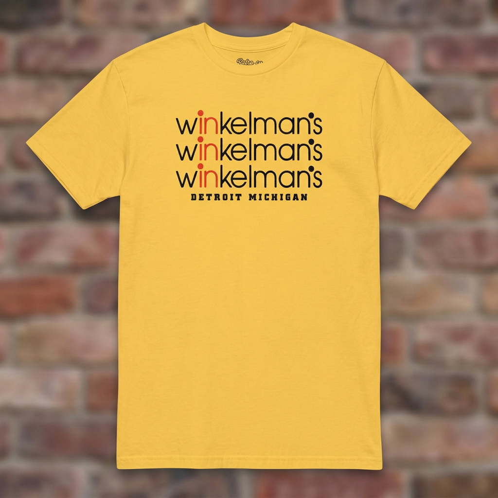 Winkelman's Daisy T-shirt flat lay on brick background