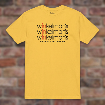Winkelman's Daisy T-shirt flat lay on brick background
