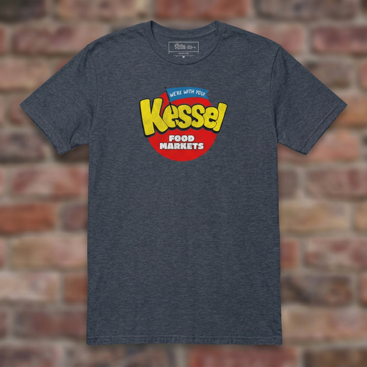 Kessel Heather Navy T-shirt flat lay on brick background