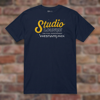 Studio Lounge Navy T-shirt flat lay on brick background