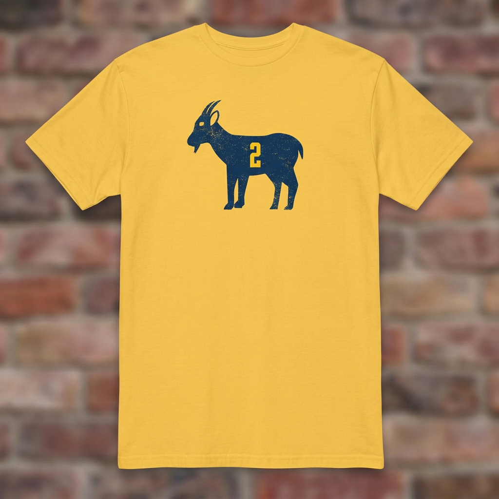 Daisy GOAT Woodson T-shirt flat-lay against weathered brick