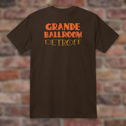 Grande Ballroom Detroit Dark Chocolate T-shirt flat lay on brick background