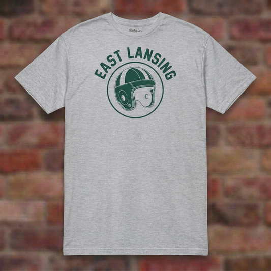 East Lansing Old School Football Sport Grey T-shirt flat lay on brick background