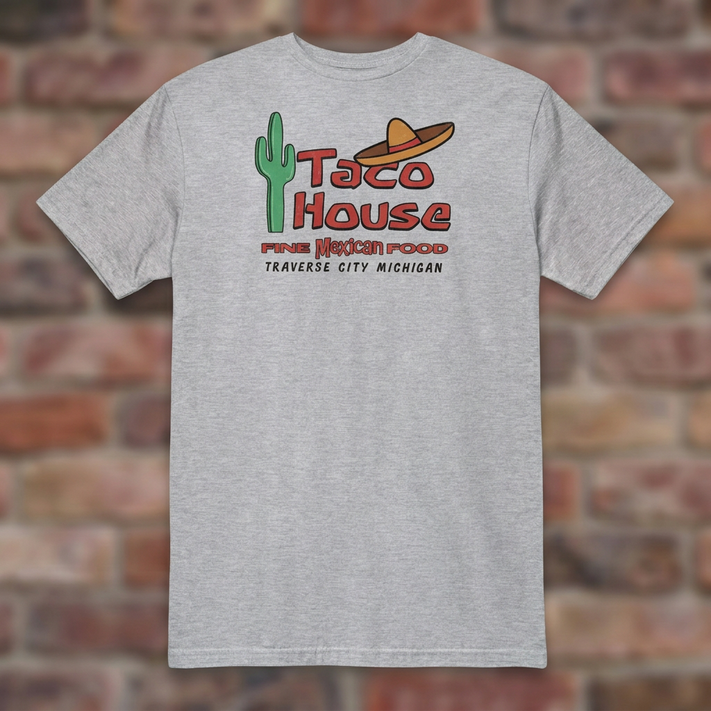 Taco House Traverse City Sport Grey T-shirt flat lay on brick background