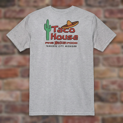 Taco House Traverse City Sport Grey T-shirt flat lay on brick background