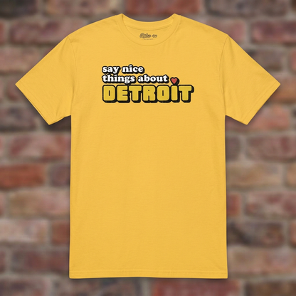Say Nice Things About Detroit Daisy T-shirt flat lay on brick background