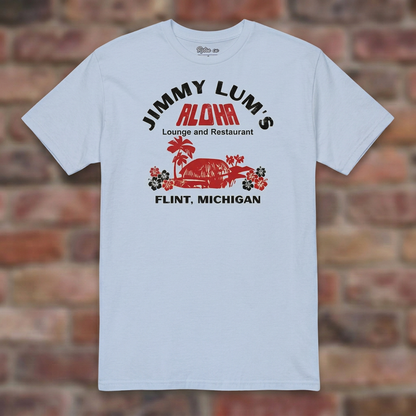 Jimmy Lum's Light Blue T-shirt flat lay on brick background