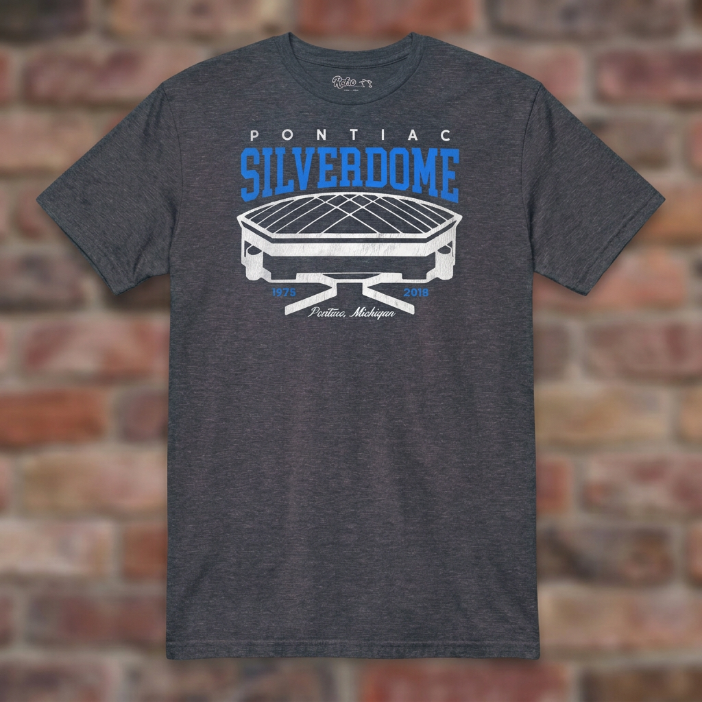 Pontiac Silverdome Heather Navy T-shirt flat lay on brick background