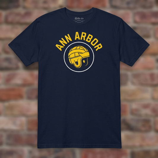 Ann Arbor Old School Football Navy T-shirt flat lay on brick background