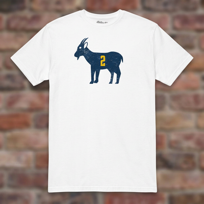 White GOAT Woodson T-shirt flat-lay against weathered brick